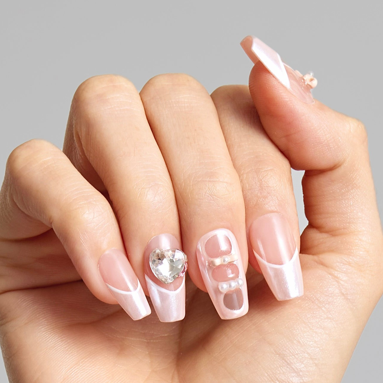 Blushing Elegance Adorned Nails